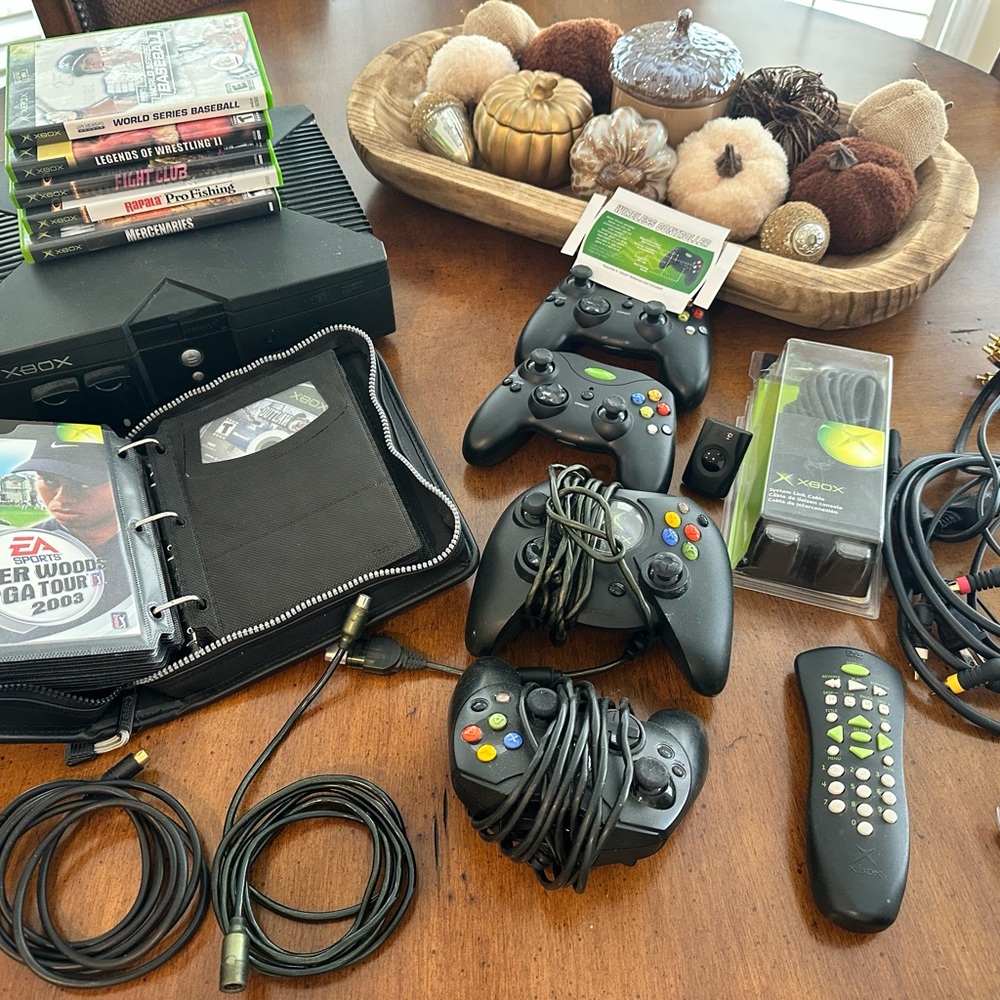 Xbox Console with 2 Black Controllers, 2 cordless controllers and 23 games.